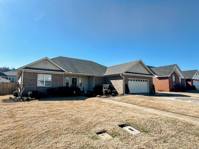 2407 Brittany, Searcy, AR 72143 - single story home with a garage, brick siding, fence, and a front lawn