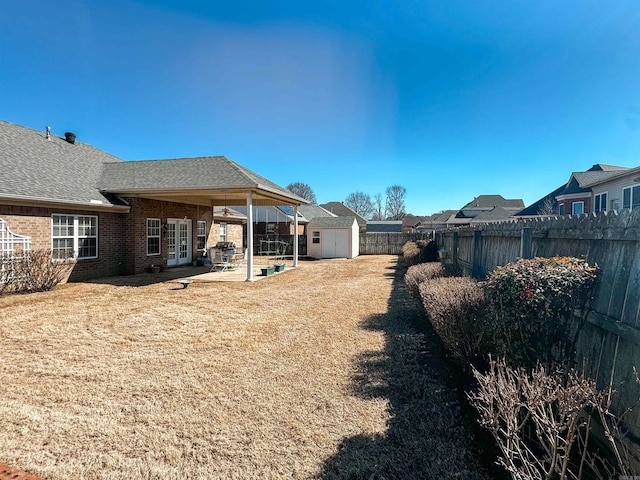 2407 Brittany, Searcy, AR 72143 - view of yard with a storage shed, a fenced backyard, a patio area, and an outdoor structure