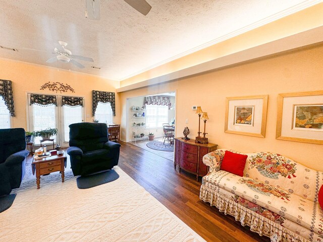 2407 Brittany, Searcy, AR 72143 - living area featuring a textured ceiling, wood finished floors, and a ceiling fan