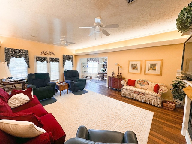 2407 Brittany, Searcy, AR 72143 - living room featuring a textured ceiling, wood finished floors, and a ceiling fan