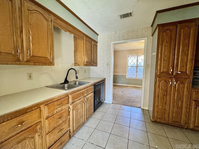 kitchen featuring wallpapered walls, black dishwasher, visible vents, a textured ceiling, and a sink