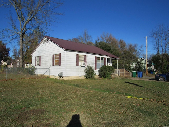 view of front of property with crawl space, metal roof, fence, and a front lawn