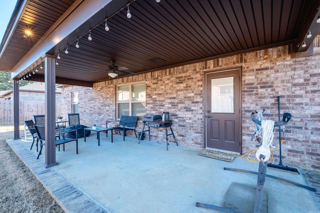 view of patio / terrace featuring ceiling fan and fence