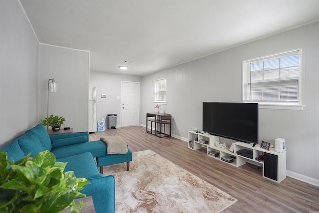 living room featuring baseboards and wood finished floors