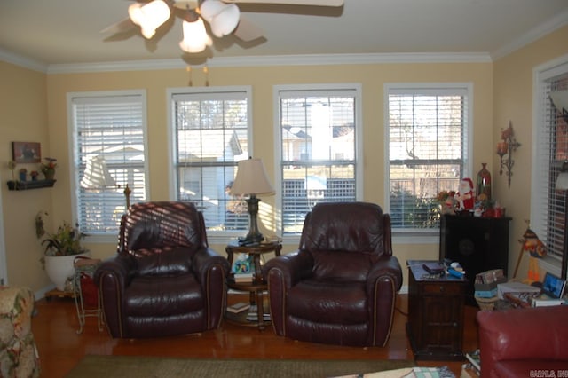 living room featuring crown molding, a ceiling fan, and wood finished floors