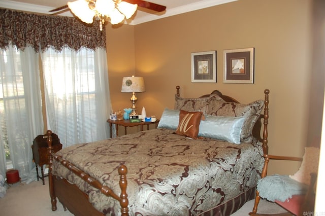 bedroom with a ceiling fan, carpet flooring, and crown molding