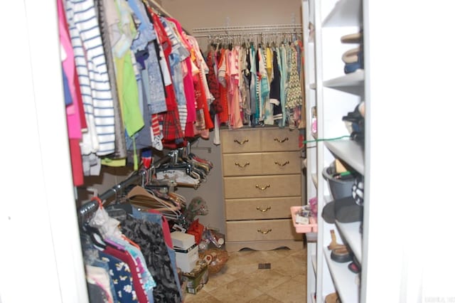 spacious closet with tile patterned flooring