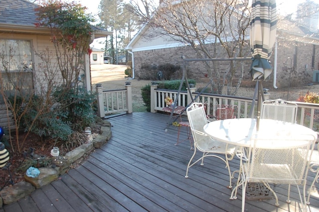 wooden deck with outdoor dining area