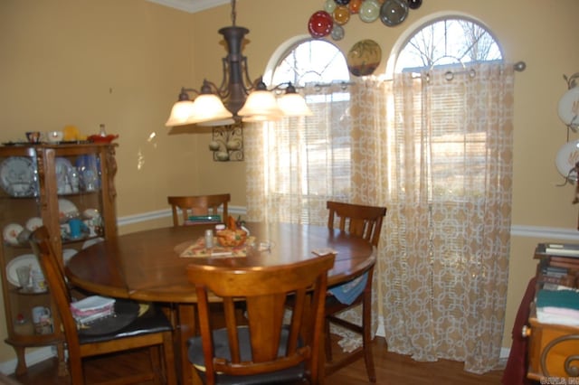 dining space with wood finished floors