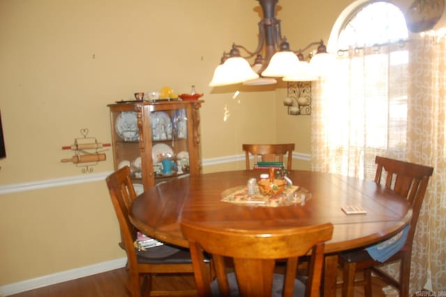 dining area featuring baseboards and wood finished floors