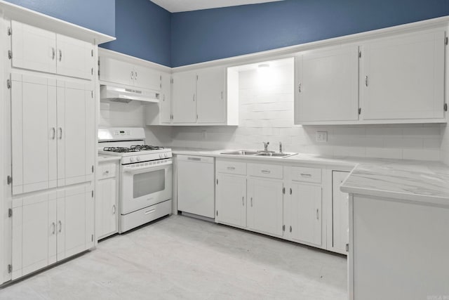 kitchen featuring white appliances, light countertops, a sink, and under cabinet range hood