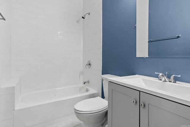 bathroom featuring toilet, shower / bathing tub combination, and vanity