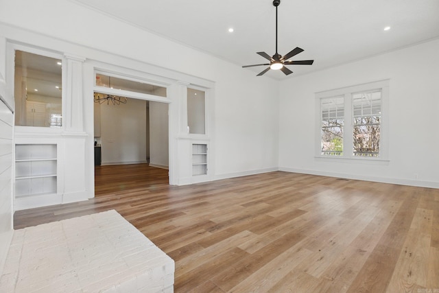 unfurnished living room featuring a ceiling fan, recessed lighting, light wood-style flooring, and baseboards