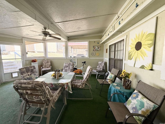 sunroom with a ceiling fan