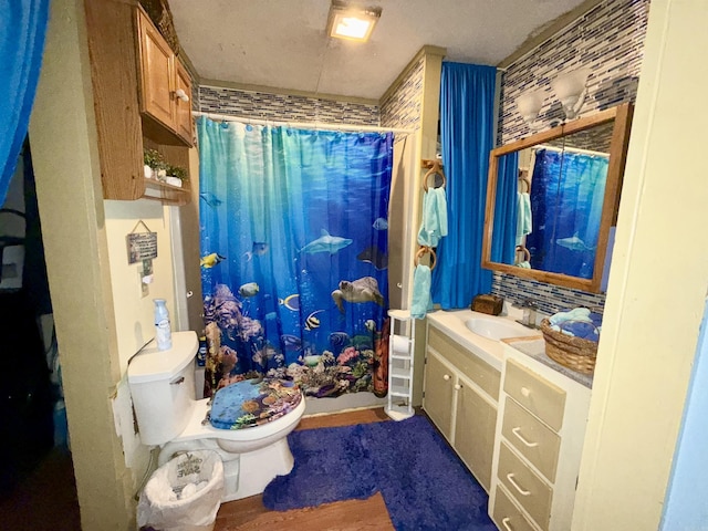 bathroom featuring shower / bath combo with shower curtain, vanity, and toilet