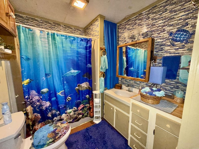 bathroom featuring backsplash, a shower with shower curtain, vanity, and toilet