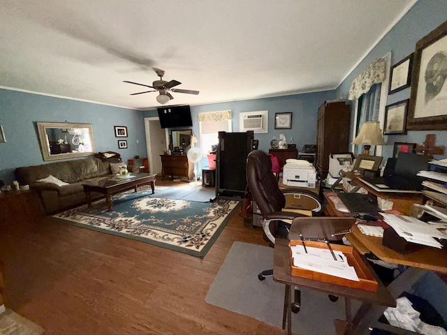 living room featuring ornamental molding, wood finished floors, and a ceiling fan