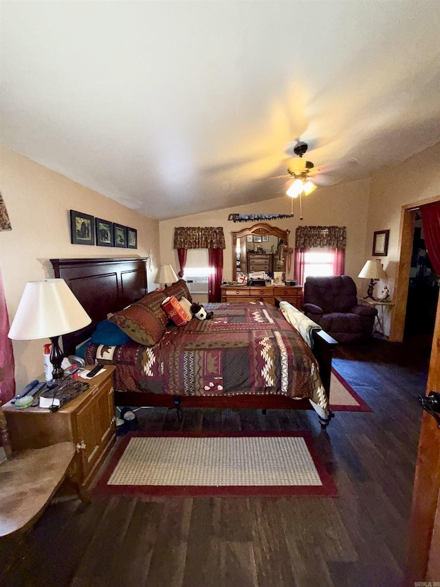 bedroom featuring lofted ceiling and wood finished floors