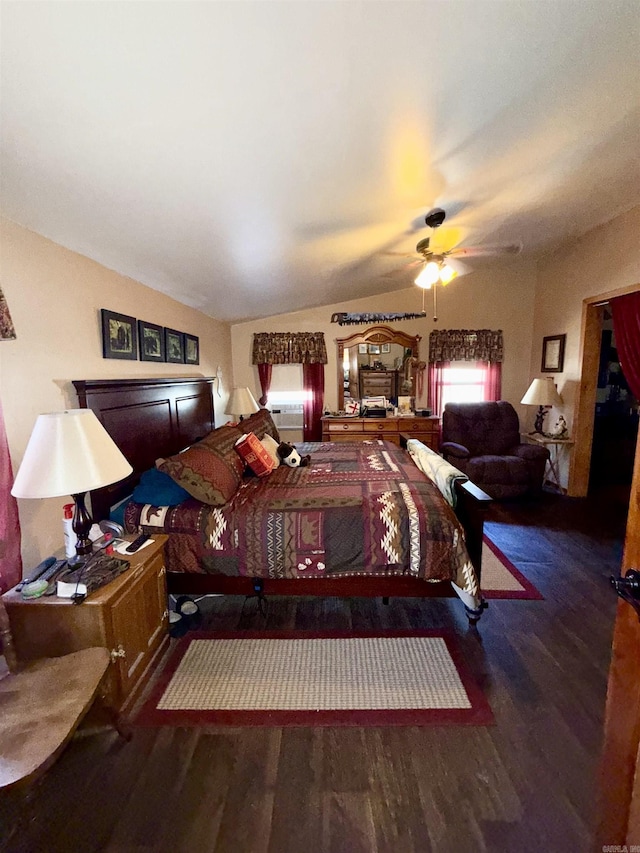 bedroom with lofted ceiling and wood finished floors