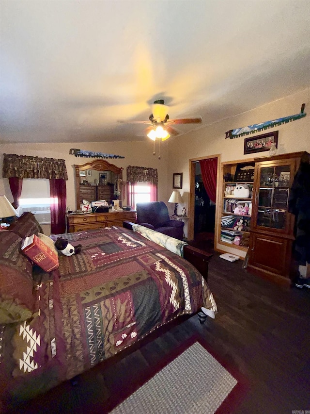 bedroom with a ceiling fan and wood finished floors