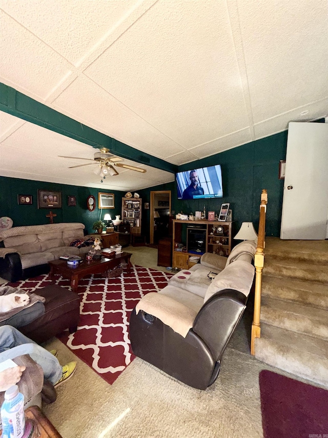 living room with a ceiling fan, a wall mounted air conditioner, and wood finished floors