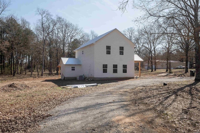 view of side of property featuring metal roof