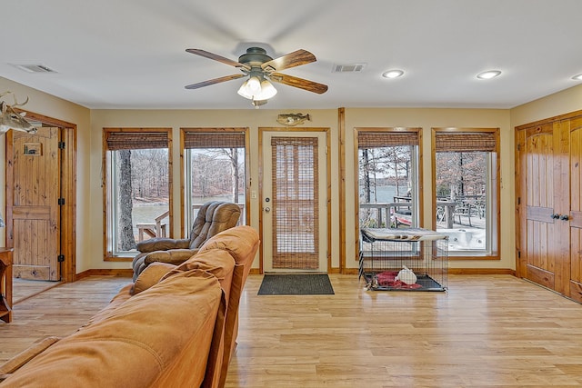 foyer entrance featuring light wood-type flooring, visible vents, and baseboards