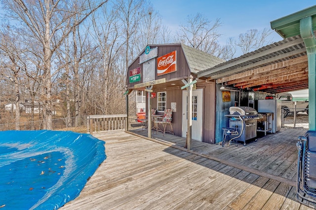 wooden deck with area for grilling