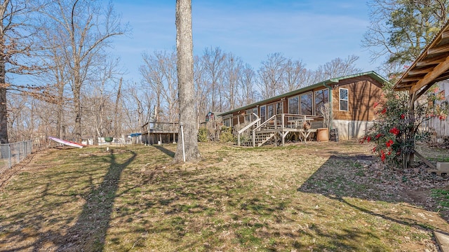 view of yard featuring stairway, fence, and a wooden deck