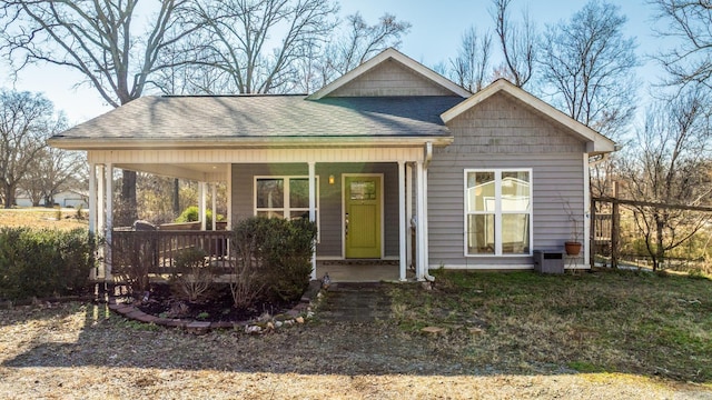 view of front of property with a porch and a shingled roof