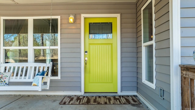 property entrance featuring a porch