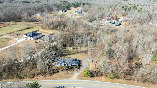 birds eye view of property featuring a rural view