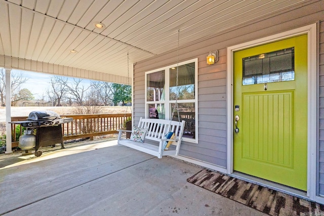 doorway to property featuring a porch