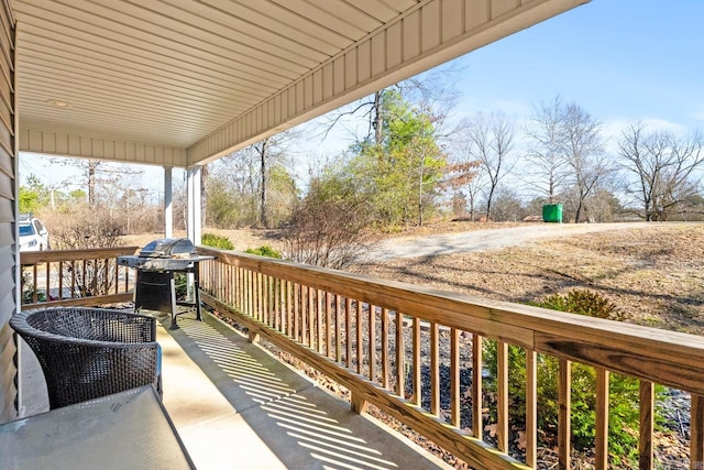 deck with a porch and grilling area