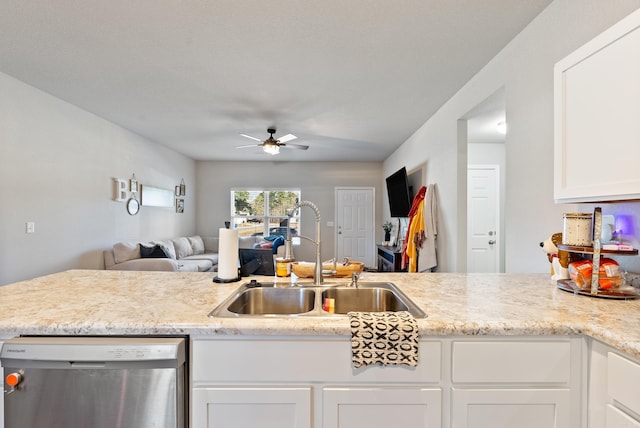 kitchen featuring stainless steel dishwasher, open floor plan, white cabinetry, a sink, and ceiling fan