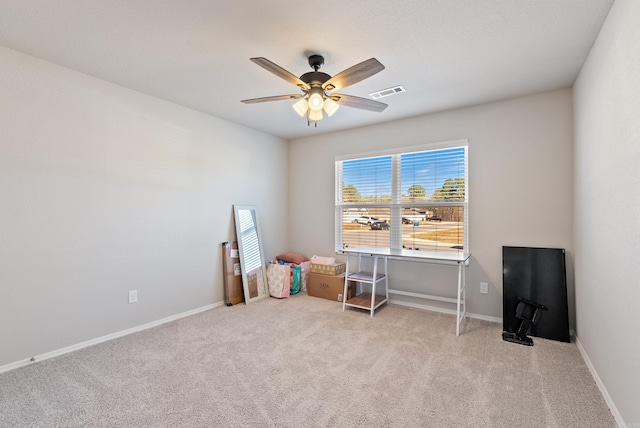 misc room featuring carpet, visible vents, baseboards, and ceiling fan