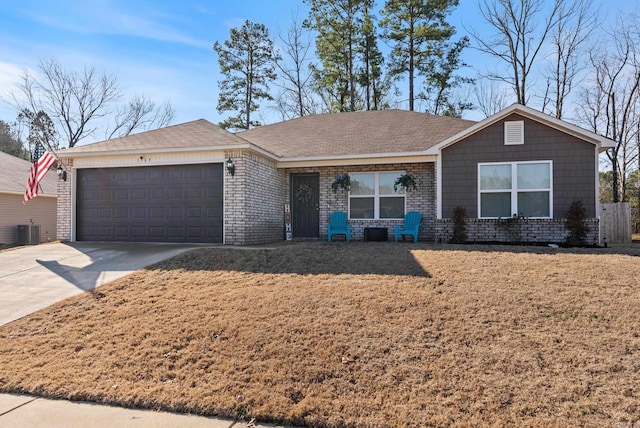 ranch-style house with concrete driveway, central AC, brick siding, and an attached garage