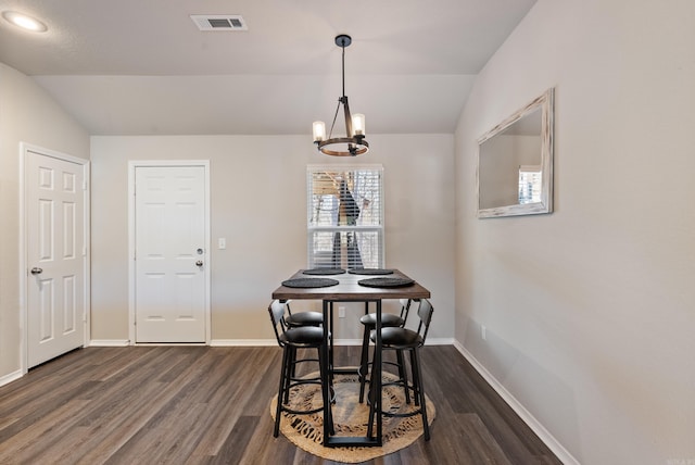 dining area with visible vents, baseboards, dark wood finished floors, vaulted ceiling, and a chandelier