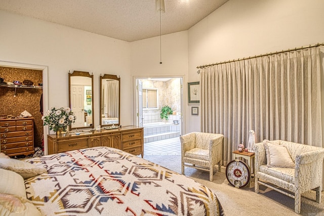 bedroom featuring carpet flooring and a walk in closet