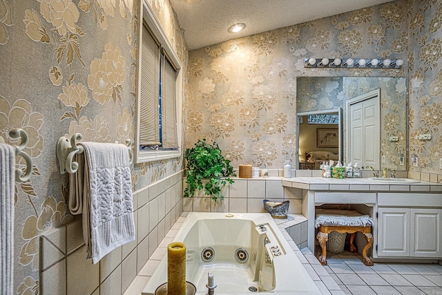 full bathroom featuring a whirlpool tub, wallpapered walls, tile patterned flooring, and a textured ceiling