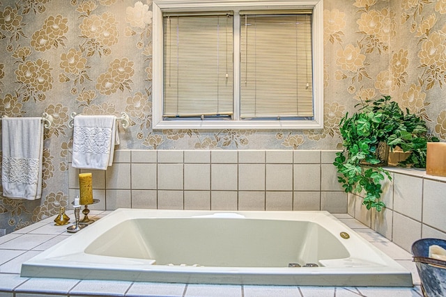 bathroom featuring a garden tub and wallpapered walls