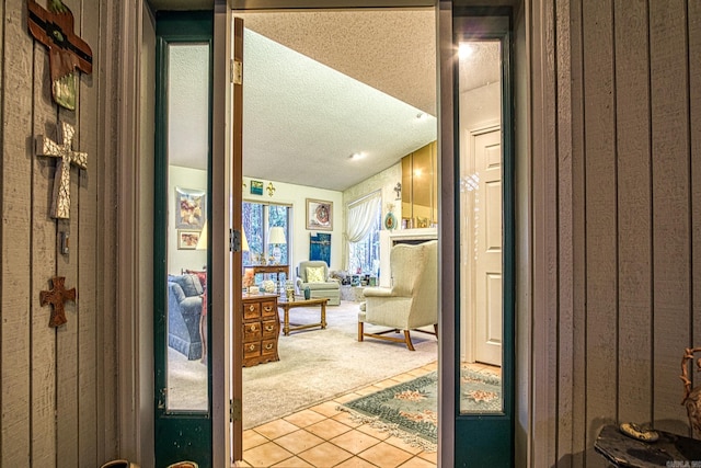 bathroom featuring a textured ceiling and tile patterned floors