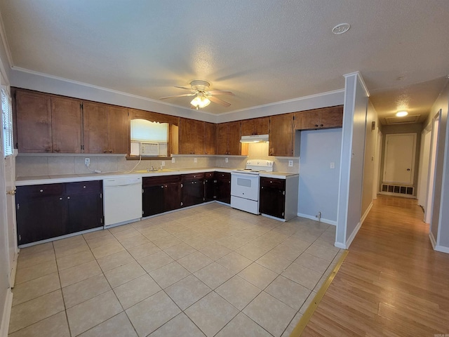 kitchen featuring under cabinet range hood, white appliances, a ceiling fan, visible vents, and light countertops