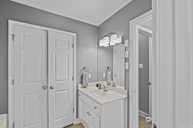 bathroom with tile patterned floors and vanity