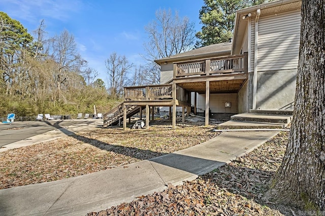 exterior space with stairs and a deck