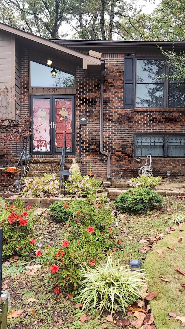 entrance to property with brick siding