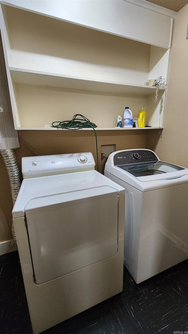 washroom featuring laundry area and washer and clothes dryer