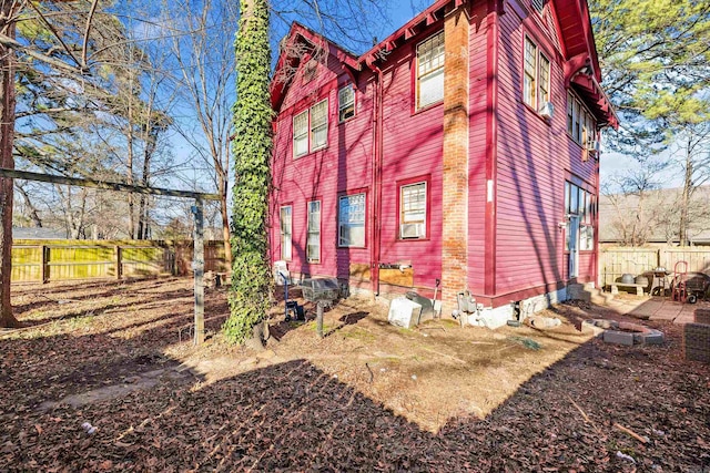 view of side of property with fence