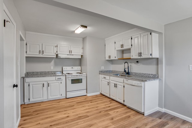 kitchen featuring white appliances, a sink, white cabinets, and under cabinet range hood