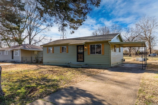 view of front of home featuring driveway, a carport, and crawl space